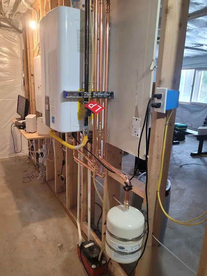 Licensed plumber repairing a kitchen sink in Lyons